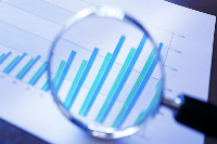 Bar chart showing data trends with vertical blue and teal bars representing different categories or time periods.