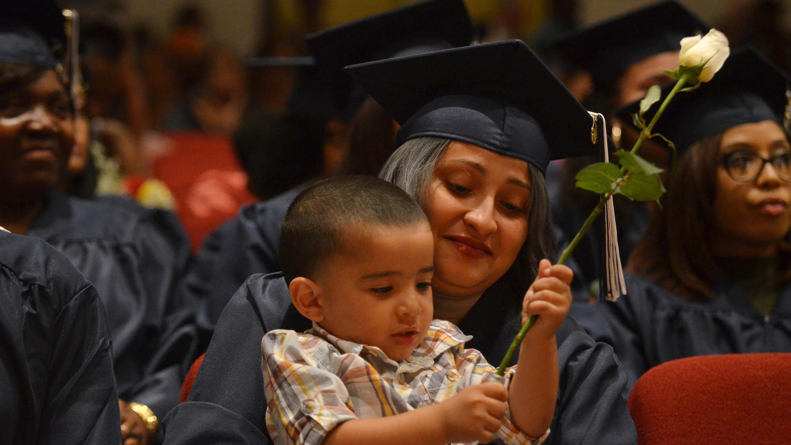 Hartford Adult Education Center graduated Ashley Flores and son. hrt-hc-hartford-adult-ed-graduation